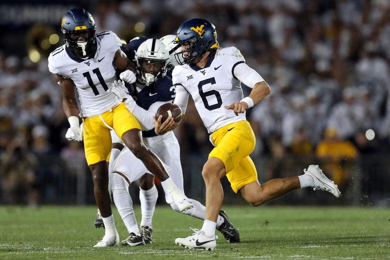 Sep 2, 2023; University Park, Pennsylvania, USA; West Virginia Mountaineers quarterback Garrett Greene (6) runs the ball against the Penn State Nittany Lions during the first quarter at Beaver Stadium. Mandatory Credit: Matthew O'Haren-USA TODAY Sports