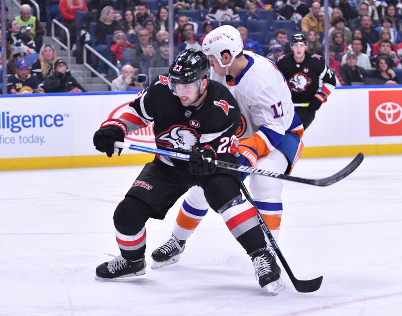 Oct 21, 2023; Buffalo, New York, USA; Buffalo Sabres defenseman Mattias Samuelsson (23) skates in front of New York Islanders left wing Matt Martin (17) in the first period at KeyBank Center. Mandatory Credit: Mark Konezny-USA TODAY Sports