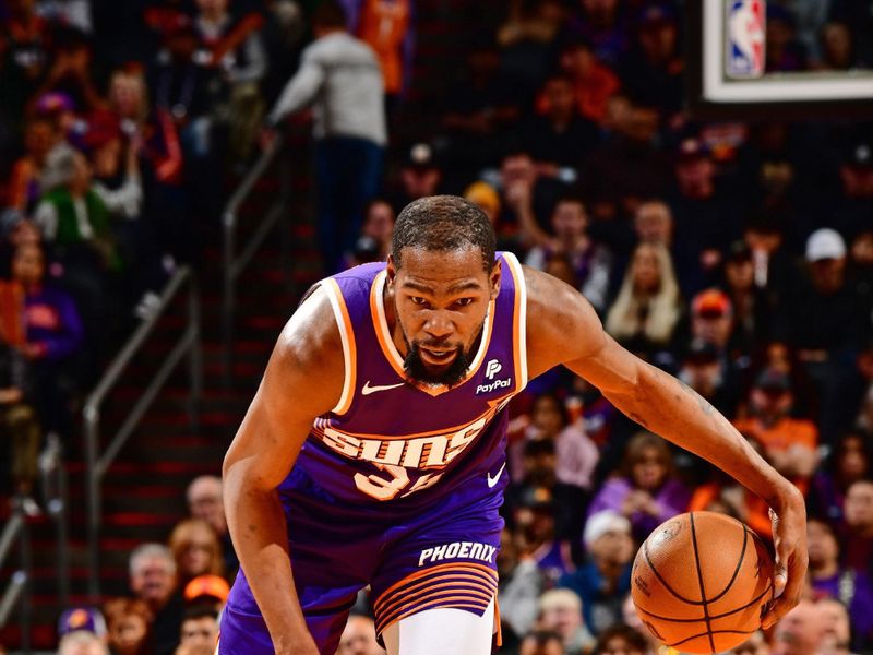 PHOENIX, AZ - JANUARY 7: Kevin Durant #35 of the Phoenix Suns dribbles the ball during the game against the Memphis Grizzlies on January 7, 2024 at Footprint Center in Phoenix, Arizona. NOTE TO USER: User expressly acknowledges and agrees that, by downloading and or using this photograph, user is consenting to the terms and conditions of the Getty Images License Agreement. Mandatory Copyright Notice: Copyright 2024 NBAE (Photo by Barry Gossage/NBAE via Getty Images)