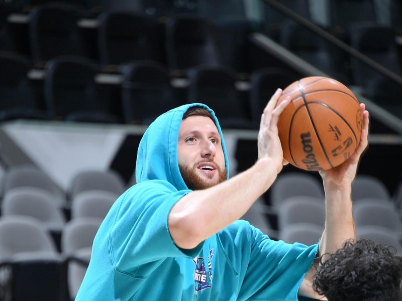 SAN ANTONIO, TX - MARCH 14:  Jusuf Nurkic #11 of the Charlotte Hornets warms up before the game against the San Antonio Spurs on March 14, 2025 at the Frost Bank Center in San Antonio, Texas. NOTE TO USER: User expressly acknowledges and agrees that, by downloading and or using this photograph, user is consenting to the terms and conditions of the Getty Images License Agreement. Mandatory Copyright Notice: Copyright 2025 NBAE (Photos by Michael Gonzales/NBAE via Getty Images)