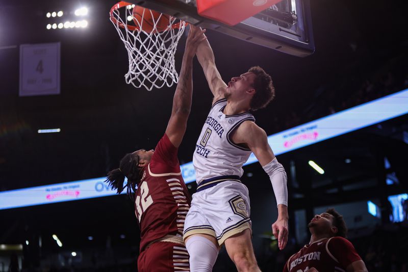 Jan 4, 2025; Atlanta, Georgia, USA; Georgia Tech Yellow Jackets guard Lance Terry (0) dunks over Boston College Eagles forward Chad Venning (32) in the second half at McCamish Pavilion. Mandatory Credit: Brett Davis-Imagn Images
