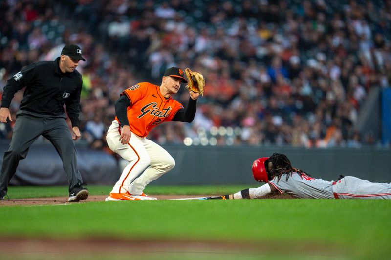 May 10, 2024; San Francisco, California, USA; Cincinnati Reds shortstop Elly De La Cruz (44) steals third base against San Francisco Giants third baseman Matt Chapman (26) during the third inning at Oracle Park. Mandatory Credit: Neville E. Guard-USA TODAY Sports