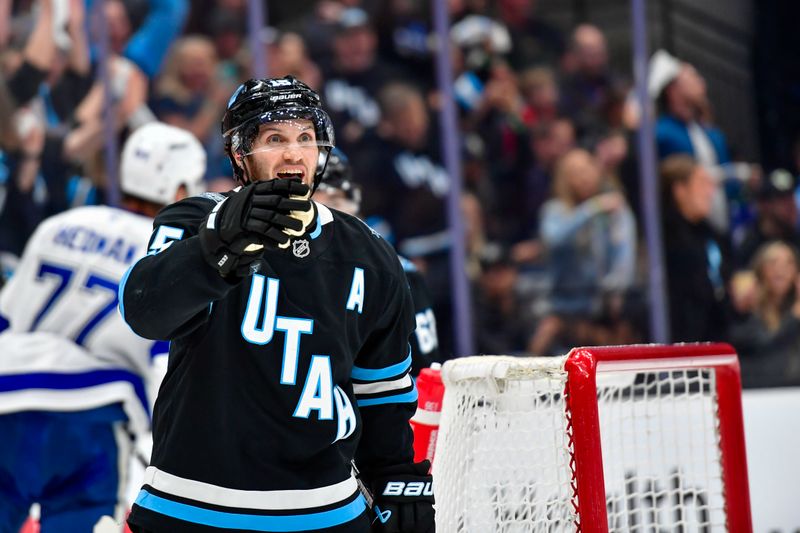 Mar 22, 2025; Salt Lake City, Utah, USA; Utah Hockey Club center Alexander Kerfoot (15) reacts after goal against the Tampa Bay Lightning during second period at the Delta Center. Mandatory Credit: Peter Creveling-Imagn Images