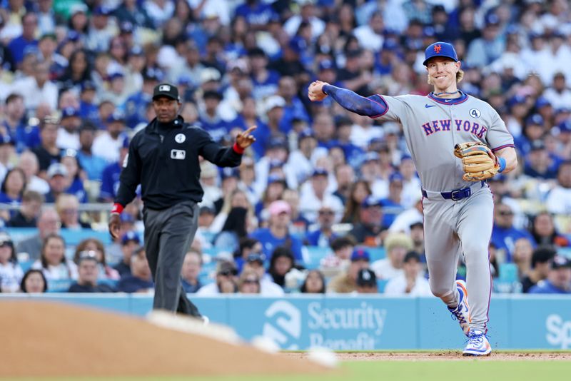Jun 2, 2025; Los Angeles, California, USA; New York Mets second base Brett Baty (7) makes a pass during the second inning against the Los Angeles Dodgers during the first inning against the New York Mets at Dodger Stadium. Mandatory Credit: Jason Parkhurst-Imagn Images