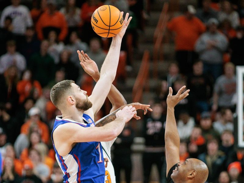 Jan 16, 2024; Stillwater, Oklahoma, USA; Kansas Jayhawks center Hunter Dickinson (1) gets the tip to start the game against the Oklahoma State Cowboys at Gallagher-Iba Arena. Mandatory Credit: William Purnell-USA TODAY Sports