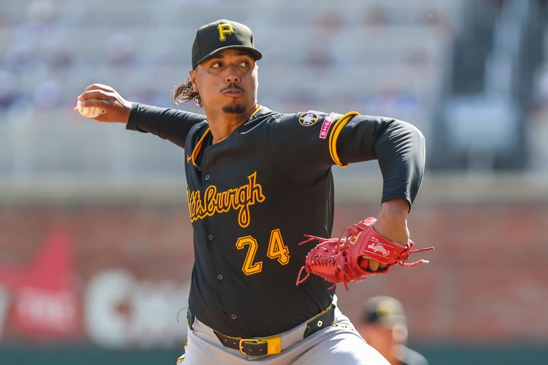 Sep 28, 2025; Cumberland, Georgia, USA; Pittsburgh Pirates pitcher Johan Oviedo (24) pitches against the Atlanta Braves during the second inning at Truist Park. Mandatory Credit: Jordan Godfree-Imagn Images
