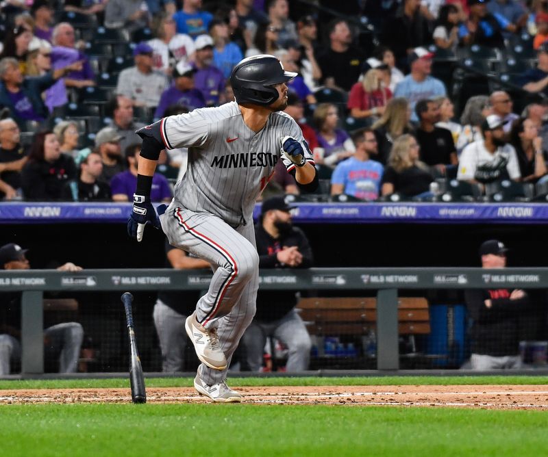 Sep 30, 2023; Denver, Colorado, USA; Minnesota Twins first baseman Alex Kirilloff (19) hits a ground-rule double in the third inning against the Colorado Rockies at Coors Field. Mandatory Credit: John Leyba-USA TODAY Sports