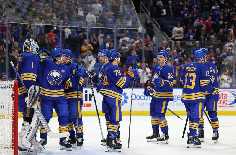 Apr 11, 2024; Buffalo, New York, USA;  The Buffalo Sabres celebrate a win over the Washington Capitals at KeyBank Center. Mandatory Credit: Timothy T. Ludwig-USA TODAY Sports