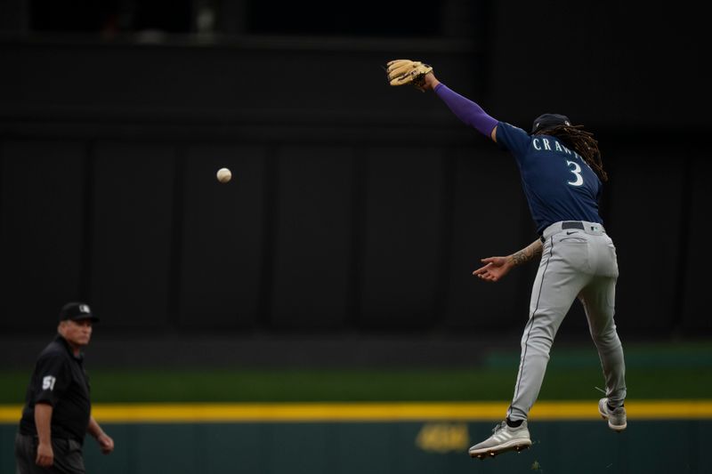 Sep 6, 2023; Cincinnati, Ohio, USA; Seattle Mariners shortstop J.P. Crawford (3) misses a line drive in the first inning of the MLB baseball game between the Cincinnati Reds and the Seattle Mariners at Great American Ball Park. Mandatory Credit: Albert Cesare-USA TODAY Sports