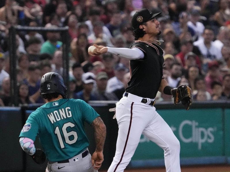 Jul 29, 2023; Phoenix, Arizona, USA; Arizona Diamondbacks third baseman Josh Rojas (10) throws to second as Seattle Mariners second baseman Kolten Wong (16) runs back to third during the second inning at Chase Field. Mandatory Credit: Joe Camporeale-USA TODAY Sports