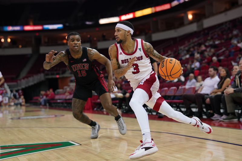 Feb 14, 2024; Fresno, California, USA; Fresno State Bulldogs guard Isaiah Hill (3) dribbles past UNLV Rebels guard Luis Rodriguez (15) in the second half at the Save Mart Center. Mandatory Credit: Cary Edmondson-USA TODAY Sports