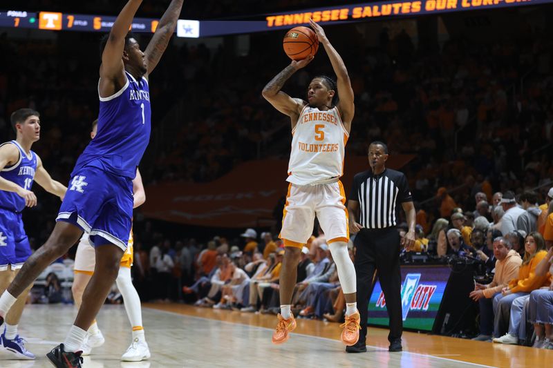 Mar 9, 2024; Knoxville, Tennessee, USA; Tennessee Volunteers guard Zakai Zeigler (5) shoots a three pointer against the Kentucky Wildcats during the second half at Thompson-Boling Arena at Food City Center. Mandatory Credit: Randy Sartin-USA TODAY Sports