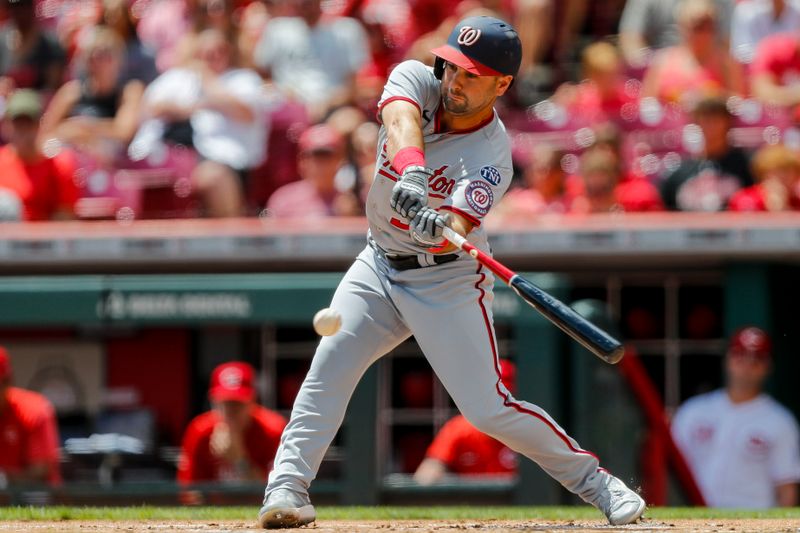 Aug 6, 2023; Cincinnati, Ohio, USA; Washington Nationals second baseman Jake Alu (39) hits a single against the Cincinnati Reds in the first inning at Great American Ball Park. Mandatory Credit: Katie Stratman-USA TODAY Sports