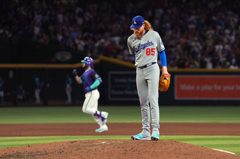 May 10, 2025; Phoenix, Arizona, USA; Los Angeles Dodgers pitcher Dustin May (85) reacts after giving up a solo home run to Arizona Diamondbacks third base Eugenio Suárez (28) during the sixth inning at Chase Field. Mandatory Credit: Joe Camporeale-Imagn Images