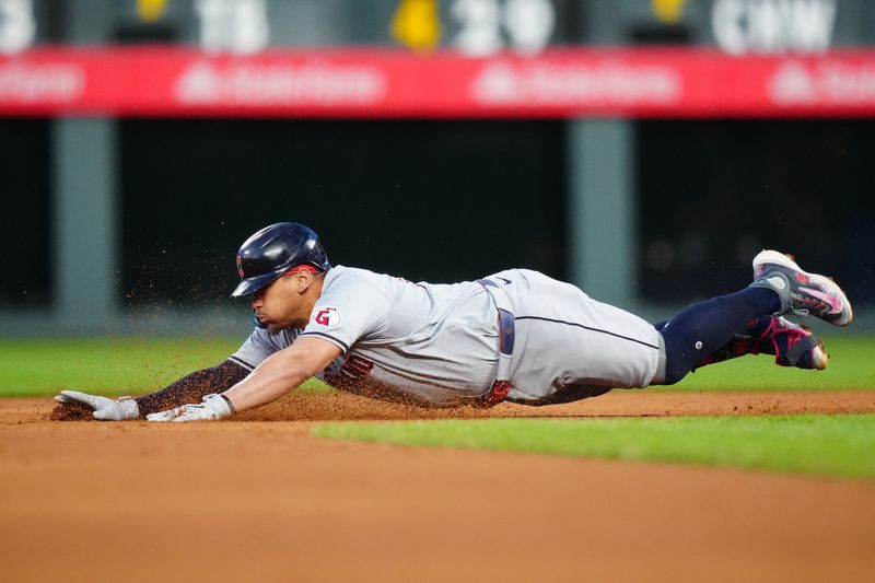 May 29, 2024; Denver, Colorado, USA; Cleveland Guardians first base Josh Naylor (22) slides into second in the sixth inning against the Colorado Rockies] at Coors Field. Mandatory Credit: Ron Chenoy-USA TODAY Sports