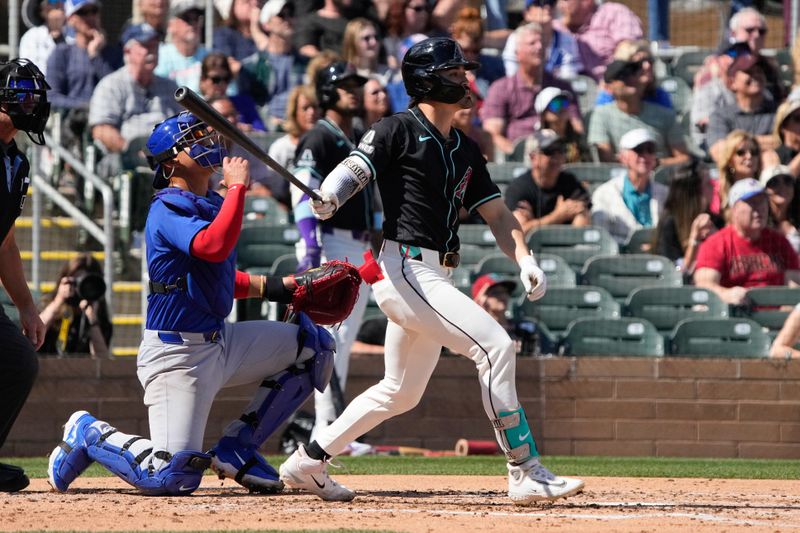 Mar 8, 2024; Salt River Pima-Maricopa, Arizona, USA; Arizona Diamondbacks left fielder Corbin Carroll (7) hits against the Chicago Cubs in the second inning at Salt River Fields at Talking Stick. Mandatory Credit: Rick Scuteri-USA TODAY Sports