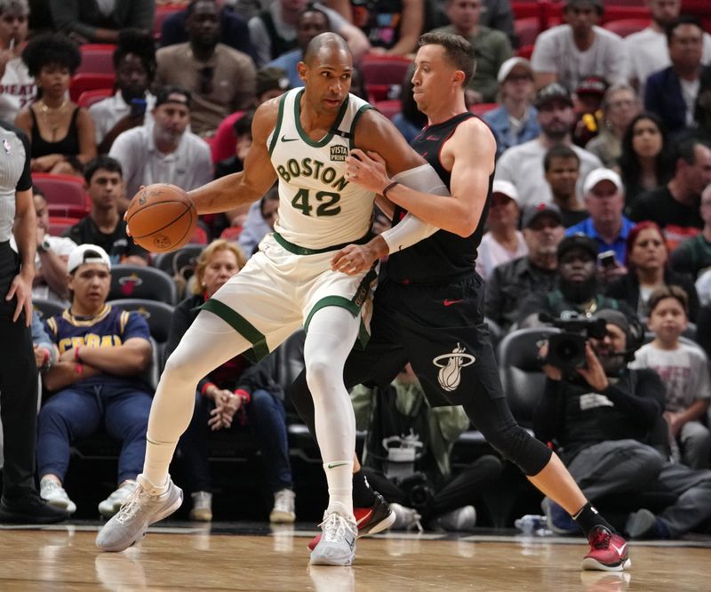 MIAMI, FL - FEBRUARY 11: Duncan Robinson #55 of the Miami Heat plays defense against Al Horford #42 of the Boston Celtics on February 11, 2024 at Kaseya Center in Miami, Florida. NOTE TO USER: User expressly acknowledges and agrees that, by downloading and or using this Photograph, user is consenting to the terms and conditions of the Getty Images License Agreement. Mandatory Copyright Notice: Copyright 2024 NBAE (Photo by Eric Espada/NBAE via Getty Images)