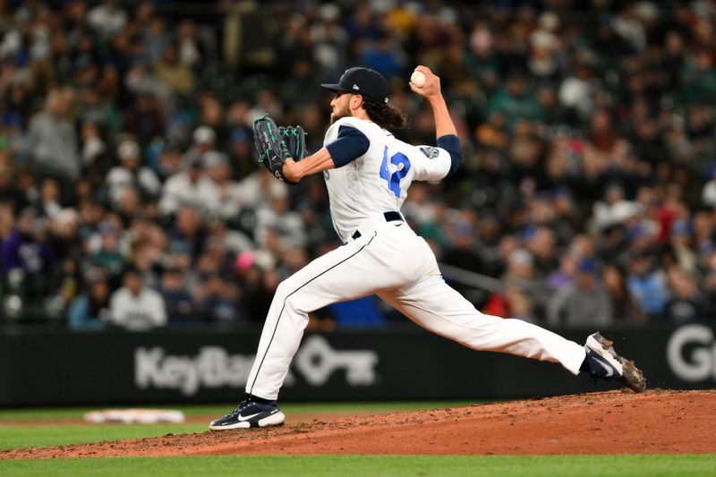 Apr 15, 2023; Seattle, Washington, USA; Seattle Mariners relief pitcher Penn Murfee (56) pitches to the Colorado Rockies during the seventh inning at T-Mobile Park. Mandatory Credit: Steven Bisig-USA TODAY Sports