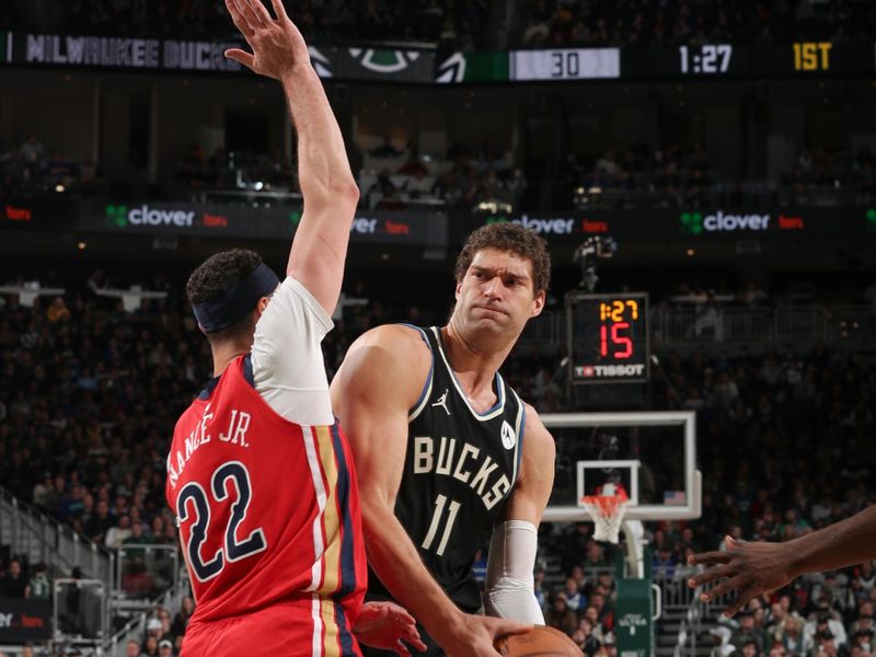 MILWAUKEE, WI - JANUARY 27:  Brook Lopez #11 of the Milwaukee Bucks goes to the basket during the game  on January 27, 2024 at the Fiserv Forum Center in Milwaukee, Wisconsin. NOTE TO USER: User expressly acknowledges and agrees that, by downloading and or using this Photograph, user is consenting to the terms and conditions of the Getty Images License Agreement. Mandatory Copyright Notice: Copyright 2024 NBAE (Photo by Gary Dineen/NBAE via Getty Images).