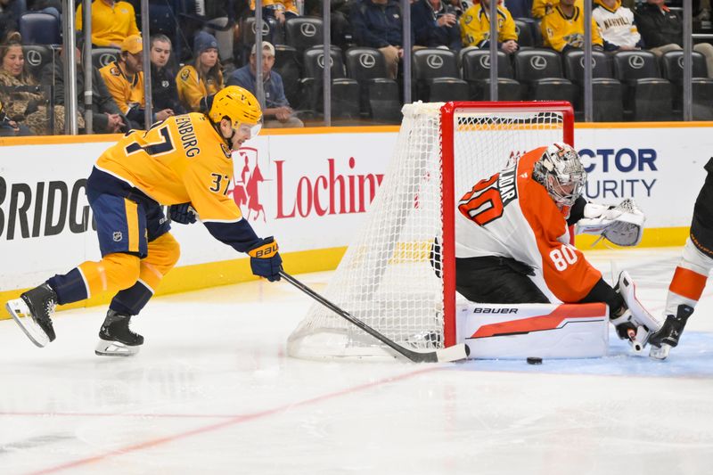 Nov 6, 2025; Nashville, Tennessee, USA;  Philadelphia Flyers goaltender Dan Vladar (80) blocks the shot of Nashville Predators defenseman Nick Blankenburg (37) during the first period at Bridgestone Arena. Mandatory Credit: Steve Roberts-Imagn Images