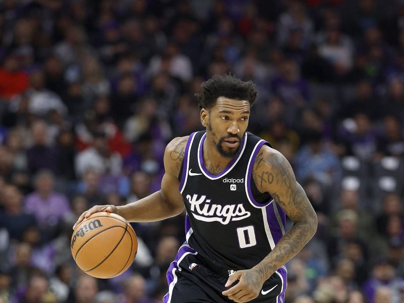 SACRAMENTO, CALIFORNIA - JANUARY 03: Malik Monk #0 of the Sacramento Kings dribbles the ball against the Orlando Magic during the first half of an NBA basketball game at Golden 1 Center on January 03, 2024 in Sacramento, California. NOTE TO USER: User expressly acknowledges and agrees that, by downloading and or using this photograph, User is consenting to the terms and conditions of the Getty Images License Agreement. (Photo by Thearon W. Henderson/Getty Images)