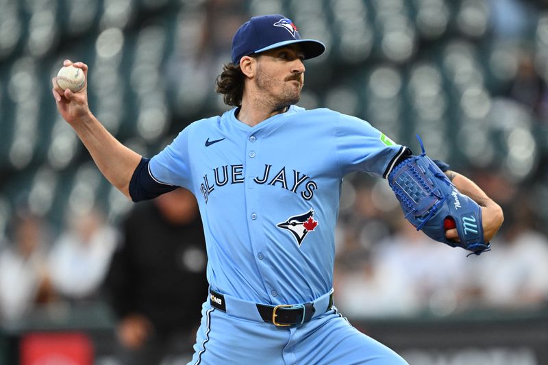 May 28, 2024; Chicago, Illinois, USA;  Toronto Blue Jays pitcher Kevin Gausman (34) pitches in the first inning against the Chicago White Sox at Guaranteed Rate Field. Mandatory Credit: Jamie Sabau-USA TODAY Sports