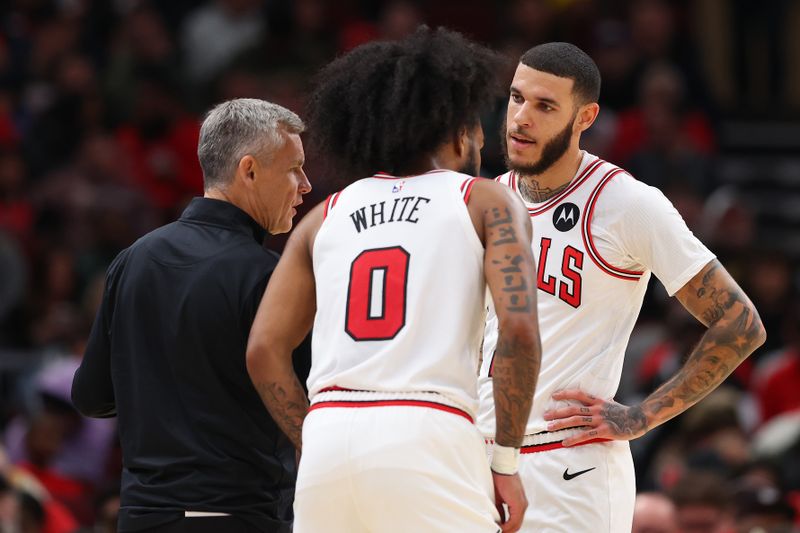 CHICAGO, ILLINOIS - OCTOBER 16: Head coach Billy Donovan of the Chicago Bulls talks with Lonzo Ball #2 and Coby White #0 against the Minnesota Timberwolves during the second half of a preseason game at the United Center on October 16, 2024 in Chicago, Illinois. NOTE TO USER: User expressly acknowledges and agrees that, by downloading and or using this photograph, User is consenting to the terms and conditions of the Getty Images License Agreement.  (Photo by Michael Reaves/Getty Images)