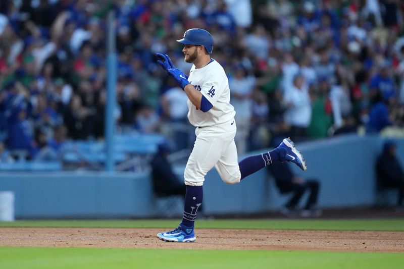 May 7, 2024; Los Angeles, California, USA; Los Angeles Dodgers third baseman Max Muncy (13) runs the bases after hitting a grand slam in the first inning against the Miami Marlins at Dodger Stadium. Mandatory Credit: Kirby Lee-USA TODAY Sports