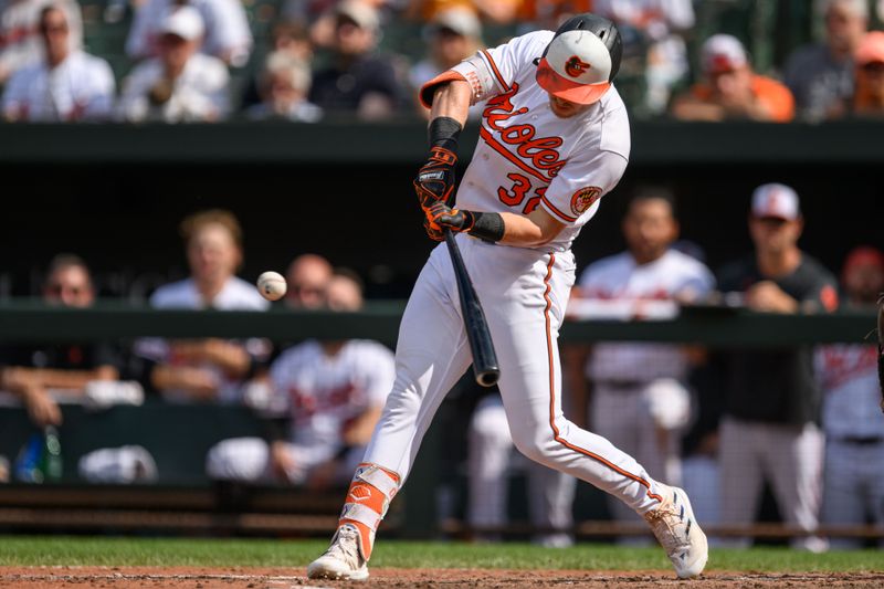 Aug 27, 2023; Baltimore, Maryland, USA; Baltimore Orioles first baseman Ryan O'Hearn (32) hits a two run home run during the eighth inning against the Colorado Rockies at Oriole Park at Camden Yards. Mandatory Credit: Reggie Hildred-USA TODAY Sports