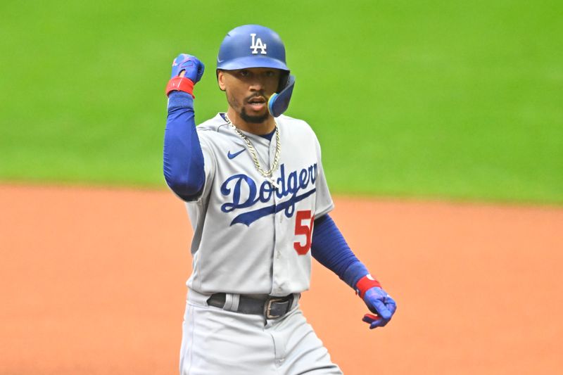 Aug 23, 2023; Cleveland, Ohio, USA; Los Angeles Dodgers right fielder Mookie Betts (50) celebrates his single in the first inning against the Cleveland Guardians at Progressive Field. Mandatory Credit: David Richard-USA TODAY Sports