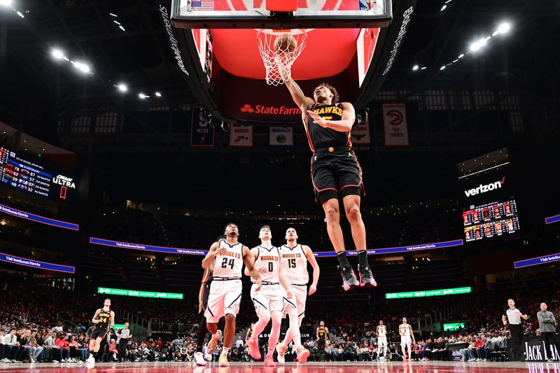 ATLANTA, GA - DECEMBER 8: Dyson Daniels #5 of the Atlanta Hawks drives to the basket during the game against the Denver Nuggets on December 8, 2024 at State Farm Arena in Atlanta, Georgia.  NOTE TO USER: User expressly acknowledges and agrees that, by downloading and/or using this Photograph, user is consenting to the terms and conditions of the Getty Images License Agreement. Mandatory Copyright Notice: Copyright 2024 NBAE (Photo by Adam Hagy/NBAE via Getty Images)