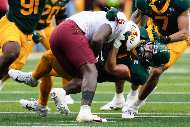 Oct 28, 2023; Waco, Texas, USA;  Iowa State Cyclones running back Cartevious Norton (5) is tackled by Baylor Bears linebacker Brooks Miller (41) during the second half at McLane Stadium. Mandatory Credit: Chris Jones-USA TODAY Sports