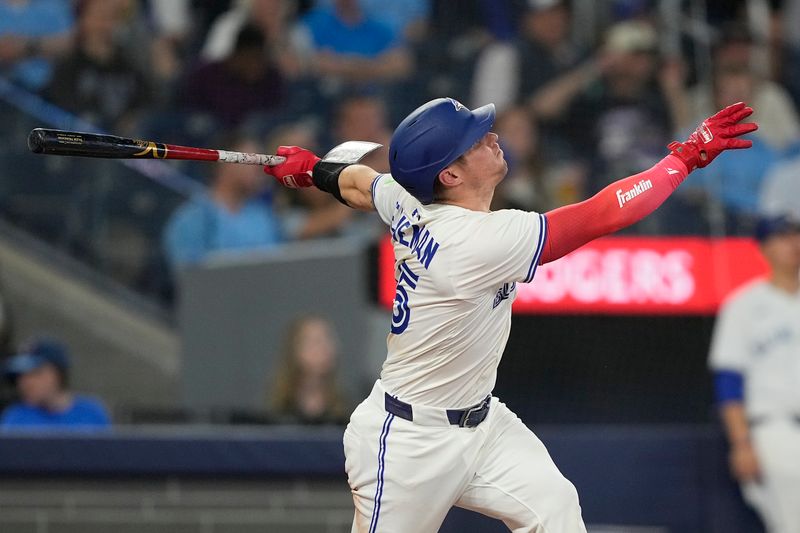 Jun 5, 2025; Toronto, Ontario, CAN; Toronto Blue Jays catcher Tyler Heineman (55) hits a two run single against the Philadelphia Phillies during the third inning at Rogers Centre. Mandatory Credit: John E. Sokolowski-Imagn Images