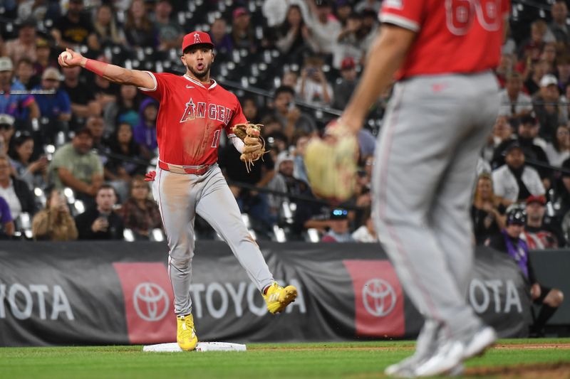 Sep 20, 2025; Denver, Colorado, USA; Los Angeles Angels third base Oswald Peraza (10) throws to first for a game-ending double play during the ninth inning against the Colorado Rockies at Coors Field. Mandatory Credit: Christopher Hanewinckel-Imagn Images