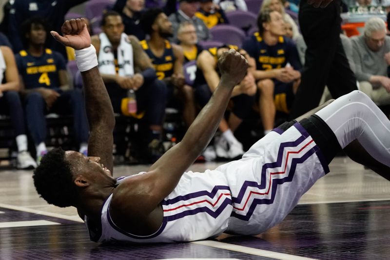 Jan 31, 2023; Fort Worth, Texas, USA; TCU Horned Frogs guard Damion Baugh (10) celebrates after drawing an offensive charge on the West Virginia Mountaineers during the second half at Ed and Rae Schollmaier Arena. Mandatory Credit: Chris Jones-USA TODAY Sports