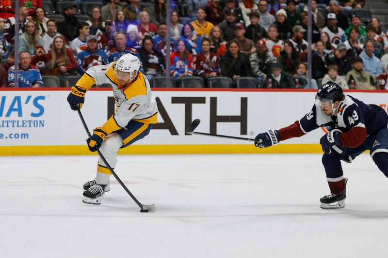 Dec 13, 2025; Denver, Colorado, USA; Nashville Predators center Tyson Jost (17) scores on a breakaway ahead of Colorado Avalanche defenseman Samuel Girard (49) in the third period at Ball Arena. Mandatory Credit: Isaiah J. Downing-Imagn Images