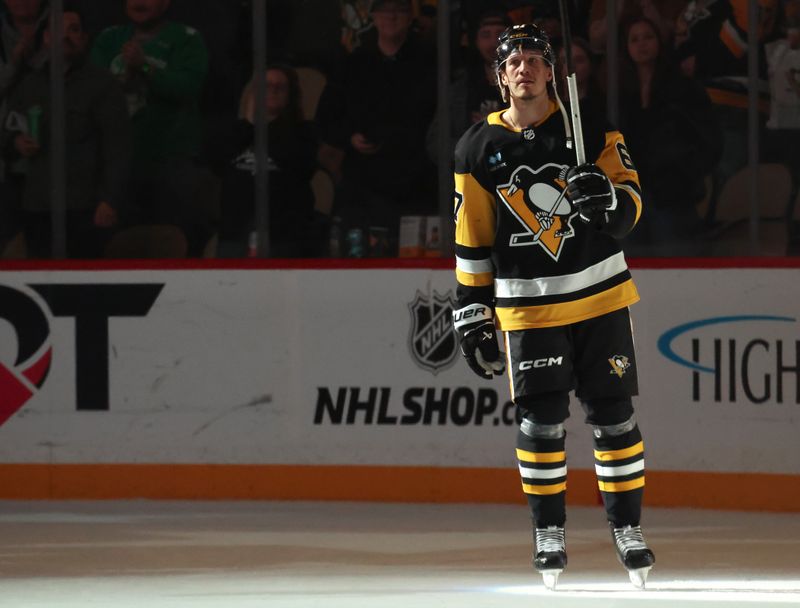 Mar 21, 2025; Pittsburgh, Pennsylvania, USA;  Pittsburgh Penguins right wing Rickard Rakell (67) reacts after being named a star of the game against the Columbus Blue Jackets at PPG Paints Arena. Mandatory Credit: Charles LeClaire-Imagn Images