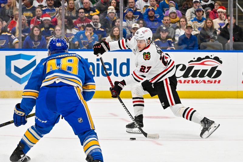Dec 23, 2023; St. Louis, Missouri, USA;  Chicago Blackhawks left wing Lukas Reichel (27) shoots against the St. Louis Blues during the first period at Enterprise Center. Mandatory Credit: Jeff Curry-USA TODAY Sports