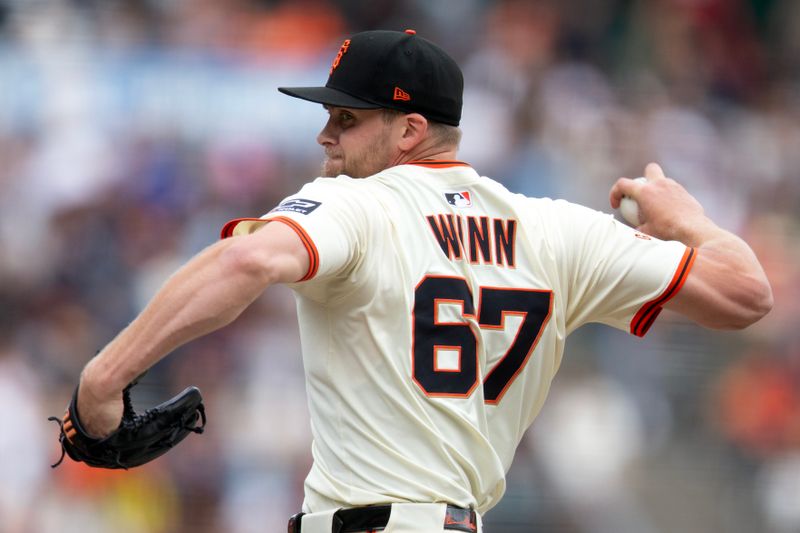 Sep 10, 2025; San Francisco, California, USA; San Francisco Giants pitcher Keaton Winn (67) delivers a pitch against the Arizona Diamondbacks during the sixth inning at Oracle Park. Mandatory Credit: D. Ross Cameron-Imagn Images