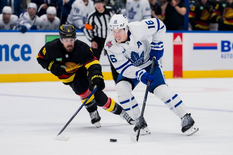 Jan 20, 2024; Vancouver, British Columbia, CAN; Vancouver Canucks forward Conor Garland (8) checks Toronto Maple Leafs forward Mitchell Marner (16) in the second period at Rogers Arena. Mandatory Credit: Bob Frid-USA TODAY Sports