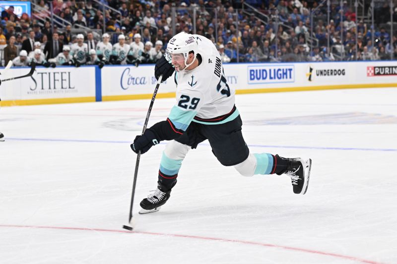 Nov 8, 2025; St. Louis, Missouri, USA; Seattle Kraken defenseman Vince Dunn (29) takes a shot against the St. Louis Blues in the third period at Enterprise Center. Mandatory Credit: Joe Puetz-Imagn Images