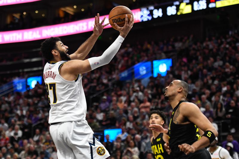 SALT LAKE CITY, UTAH - APRIL 09: Jamal Murray #27 of the Denver Nuggets drives to the basket against Talen Horton-Tucker #5 of the Utah Jazz during the second half at Delta Center on April 09, 2024 in Salt Lake City, Utah. NOTE TO USER: User expressly acknowledges and agrees that, by downloading and or using this photograph, User is consenting to the terms and conditions of the Getty Images License Agreement.  (Photo by Alex Goodlett/Getty Images)