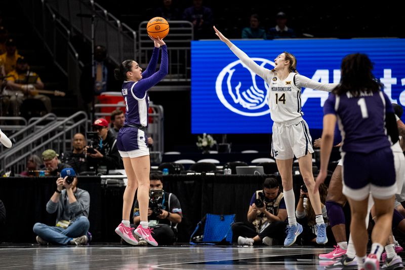 Mar 7, 2025; Kansas City, MO, USA; Kansas State Wildcats guard Jaelyn Glenn (3) shoots the ball while defended by West Virginia Mountaineers Kylee Blacksten (14) in the first quarter at T-Mobile Center. Mandatory Credit: Amy Kontras-Imagn Images