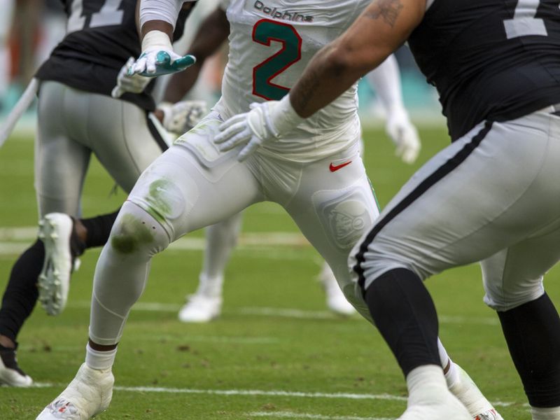 Miami Dolphins linebacker Bradley Chubb (2) battles Las Vegas Raiders guard Jermaine Eluemunor during the first half of an NFL football game, Sunday, Nov. 19, 2023, in Miami Gardens, Fla. (AP Photo/Michael Laughlin)