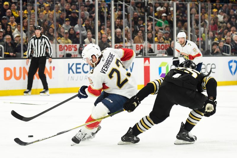 May 17, 2024; Boston, Massachusetts, USA; Florida Panthers center Carter Verhaeghe (23) stick handles past Boston Bruins defenseman Brandon Carlo (25) during the second period in game six of the second round of the 2024 Stanley Cup Playoffs at TD Garden. Mandatory Credit: Bob DeChiara-USA TODAY Sports