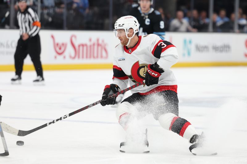 Oct 22, 2024; Salt Lake City, Utah, USA; Ottawa Senators defenseman Nick Jensen (3) moves the puck against the Utah Hockey Club during the first period at Delta Center. Mandatory Credit: Rob Gray-Imagn Images