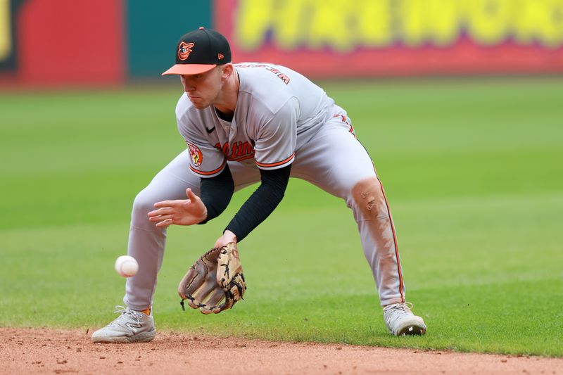 Sep 24, 2023; Cleveland, Ohio, USA; Baltimore Orioles second baseman Jordan Westburg (11) fields a ball hit by Cleveland Guardians first baseman Kole Calhoun (56) during the sixth inning at Progressive Field. Mandatory Credit: Aaron Josefczyk-USA TODAY Sports