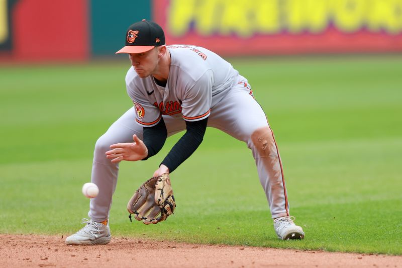 Sep 24, 2023; Cleveland, Ohio, USA; Baltimore Orioles second baseman Jordan Westburg (11) fields a ball hit by Cleveland Guardians first baseman Kole Calhoun (56) during the sixth inning at Progressive Field. Mandatory Credit: Aaron Josefczyk-USA TODAY Sports