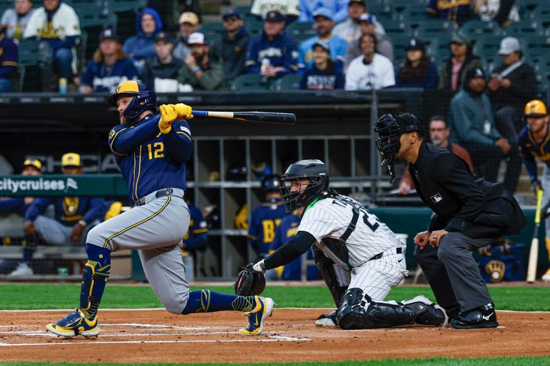 Apr 30, 2025; Chicago, Illinois, USA; Milwaukee Brewers first baseman Rhys Hoskins (12) reaches on the fielding error against the Chicago White Sox during the first inning at Rate Field. Mandatory Credit: Kamil Krzaczynski-Imagn Images