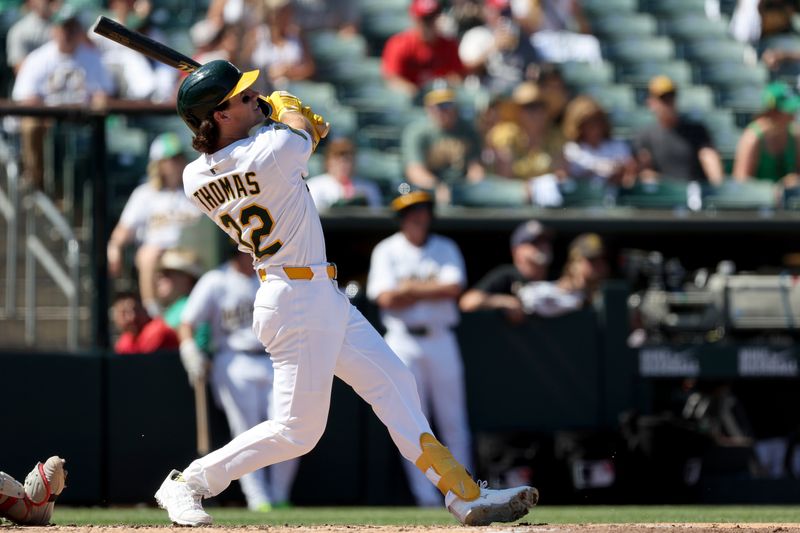Sep 14, 2025; West Sacramento, California, USA; Athletics center fielder Colby Thomas (32) hits a solo home run against the Cincinnati Reds during the fourth inning at Sutter Health Park. Mandatory Credit: Dennis Lee-Imagn Images